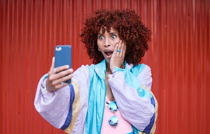wow-surprise-woman-with-smartphone-gossip-announcement-red-wall-background-person-model-girl-with-cellphone-expression-shock-with-notification-social-media-wtf-reaction